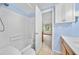 The bathroom has a white tub and shower with tiled walls at 1777 Main St, Georgetown, CO 80444