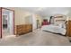 Bedroom with a large bed, closet, and window, providing natural light at 1777 Main St, Georgetown, CO 80444