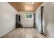 Cozy bedroom featuring hardwood floors, a window with natural light, and neutral color scheme at 1777 Main St, Georgetown, CO 80444