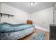 Simple bedroom with hardwood floors, a dresser, and a closet door, offering a blank canvas at 1777 Main St, Georgetown, CO 80444
