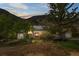 Charming home nestled in the mountains with solar panels, a well-kept yard, and a cozy front porch at 1777 Main St, Georgetown, CO 80444