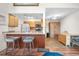 Well-lit kitchen with a breakfast bar, modern appliances, and ample cabinet space with dining area at 1777 Main St, Georgetown, CO 80444