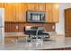 This kitchen features a stainless steel gas range and natural wood cabinets at 1777 Main St, Georgetown, CO 80444