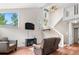 Inviting living room with a staircase, large windows offering views, and a cozy seating area at 1777 Main St, Georgetown, CO 80444