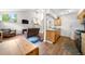 Bright and airy living area open to the kitchen, showcasing a cozy seating area and a staircase at 1777 Main St, Georgetown, CO 80444