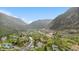 Aerial view of a town nestled in a valley with mountains and a highway at 1777 Main St, Georgetown, CO 80444