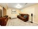 Finished basement featuring carpet, neutral paint and a comfortable seating area at 12632 W Virginia Ave, Lakewood, CO 80228