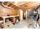Unfinished basement area with work bench and peg board at 12632 W Virginia Ave, Lakewood, CO 80228