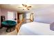 Comfortable bedroom with a ceiling fan and view to walk-in closet and hall at 12632 W Virginia Ave, Lakewood, CO 80228
