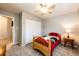 Inviting bedroom features a ceiling fan and neutral walls for a relaxing atmosphere at 12632 W Virginia Ave, Lakewood, CO 80228