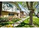 Well-kept townhouses with neat landscaping and tree-lined walkways, showcasing suburban charm at 12632 W Virginia Ave, Lakewood, CO 80228