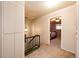 Hallway features a staircase and doorways to multiple bedrooms at 12632 W Virginia Ave, Lakewood, CO 80228