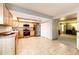 Spacious kitchen with stainless steel appliances, light wood cabinetry, and tile flooring at 12632 W Virginia Ave, Lakewood, CO 80228