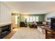 Inviting living room featuring a fireplace, comfortable seating, and ample natural light at 12632 W Virginia Ave, Lakewood, CO 80228