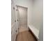 Walk-in closet features a built-in bench and an open door leading to more space at 6077 Caribou Dr, Brighton, CO 80601