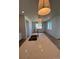 Bright kitchen featuring a large quartz countertop island and stainless steel faucet at 6077 Caribou Dr, Brighton, CO 80601