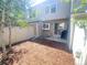 Private backyard with a patio, shed, and wood chips at 9659 W Chatfield Ave # C, Littleton, CO 80128