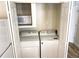 Stackable washer and dryer in a closet at 9659 W Chatfield Ave # C, Littleton, CO 80128