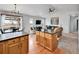 Open-concept living room and kitchen featuring hardwood floors, granite countertops, and stainless steel appliances at 3786 Settler Ridge Dr, Mead, CO 80542