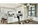 Bright, modern kitchen with stainless steel appliances, white cabinetry, and a center island at 7243 Prairie Sage Ln, Littleton, CO 80125