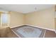 Spacious basement area with neutral-toned walls and classic accent rug at 13993 E Jewell Ave, Aurora, CO 80012