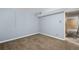 Partially finished basement with carpeting and blue walls at 13993 E Jewell Ave, Aurora, CO 80012