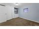 Unfinished basement area with laundry machines, neutral walls, and carpeting at 13993 E Jewell Ave, Aurora, CO 80012