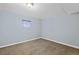 Finished basement bedroom with neutral-toned walls and carpet at 13993 E Jewell Ave, Aurora, CO 80012