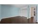 Bedroom featuring hardwood floors, built-in storage, and neutral paint at 13993 E Jewell Ave, Aurora, CO 80012