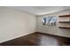 Empty bedroom featuring wood floors, natural light, and lots of space at 13993 E Jewell Ave, Aurora, CO 80012