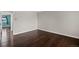 Empty bedroom featuring wood floors, natural light, and lots of space at 13993 E Jewell Ave, Aurora, CO 80012