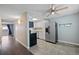 Functional kitchen with stainless steel appliances and dining area with a modern ceiling fan at 13993 E Jewell Ave, Aurora, CO 80012