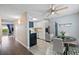 Efficient kitchen with stainless steel appliances and adjacent dining area with a ceiling fan at 13993 E Jewell Ave, Aurora, CO 80012