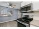 Well-equipped kitchen offering stainless steel appliances and lots of natural light at 13993 E Jewell Ave, Aurora, CO 80012