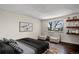 Comfortable bedroom with hardwood floors, stylish decor, and natural light at 13993 E Jewell Ave, Aurora, CO 80012