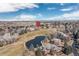 Aerial view of the property situated near a pond and golf course within a well-manicured neighborhood, marked by a pin at 538 Fairfield Ln, Louisville, CO 80027
