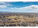 Panoramic aerial view of the residential community nestled among lush greenery and trees at 538 Fairfield Ln, Louisville, CO 80027