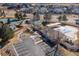 Aerial view of the community pool, tennis courts, and parking lot at 538 Fairfield Ln, Louisville, CO 80027