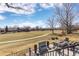 Backyard with a view, an outdoor fire pit, manicured lawns and mature trees at 538 Fairfield Ln, Louisville, CO 80027