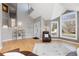 Bright living room featuring vaulted ceilings, large windows, light gray walls, and beautiful hardwood flooring at 538 Fairfield Ln, Louisville, CO 80027
