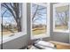 Relaxing corner of the main bedroom with a scenic view from several large windows overlooking the outside landscape at 538 Fairfield Ln, Louisville, CO 80027