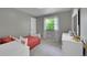 Bedroom with a window and a chest of drawers at 7439 S Depew St, Littleton, CO 80128