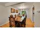 Formal dining room featuring a wood table with seating for six and a decorative chandelier at 7439 S Depew St, Littleton, CO 80128