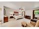 Spacious main bedroom featuring ample natural light, ceiling fan, and neutral color palette at 7439 S Depew St, Littleton, CO 80128