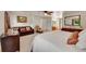 Cozy main bedroom including a seating area, dresser, and a view of the outdoors at 7439 S Depew St, Littleton, CO 80128