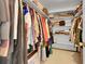 Walk-in closet offering ample storage with built-in shelving and hanging space at 7439 S Depew St, Littleton, CO 80128