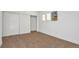 Bedroom featuring a closet, window with light curtains, and neutral wall color at 2918 W 2Nd Ave, Denver, CO 80219