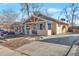 Street view of a single-story home with inviting front porch at 2918 W 2Nd Ave, Denver, CO 80219