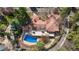 Stunning aerial view of a home with a red tile roof, a pool, and an outdoor patio at 2111 E Alameda Ave, Denver, CO 80209