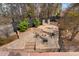 Aerial view of the backyard featuring a stone patio, fire pit and mature trees at 2111 E Alameda Ave, Denver, CO 80209